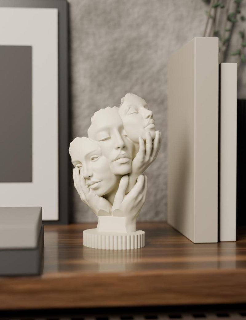 Three Face Sculpture
